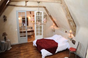 Bird's eye view of the bedroom and glimpse of the bathroom