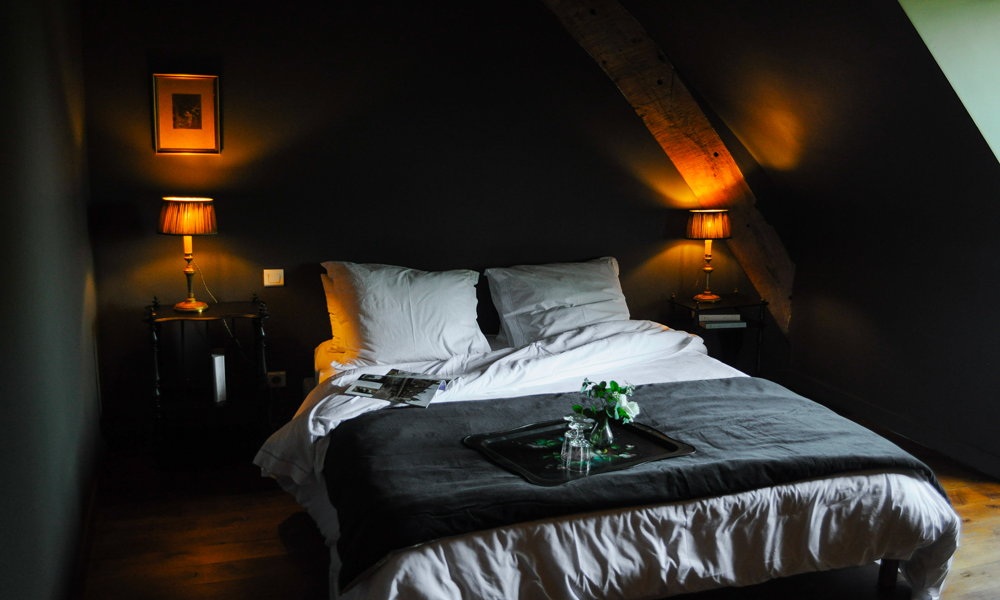 view of the bed of the room Cute cozy decor for this guest room